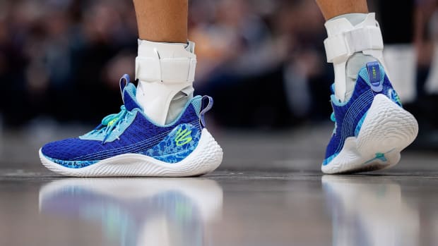 View of Stephen Curry's blue and white shoes.